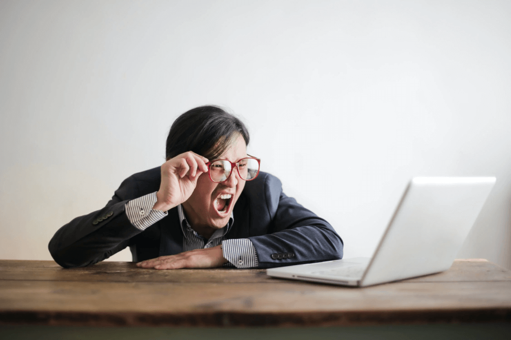 Picture of a frustrated business person looking at a laptop, negotiation, sound negotiator, ai.