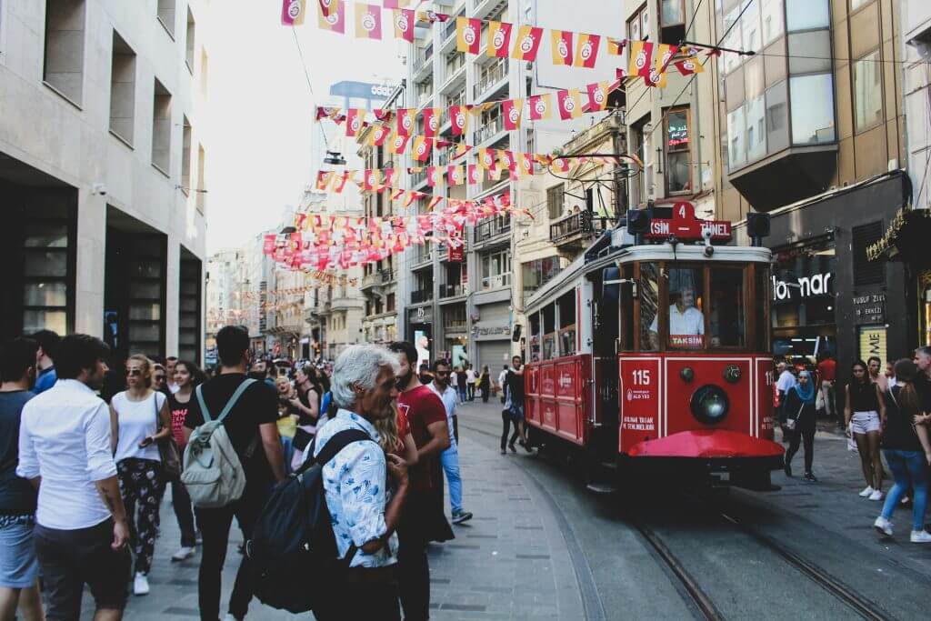 Busy street, diverse crowd, sound negotiator, ai.