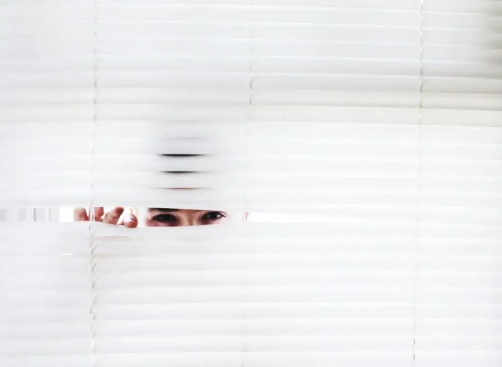 Man looking through blinds, gathering intelligence, sound negotiator, ai.